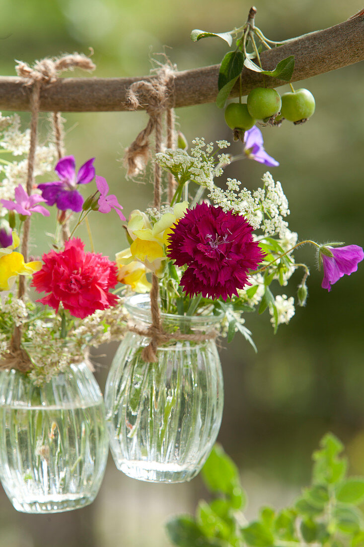 Mini bouquets in hanging jars