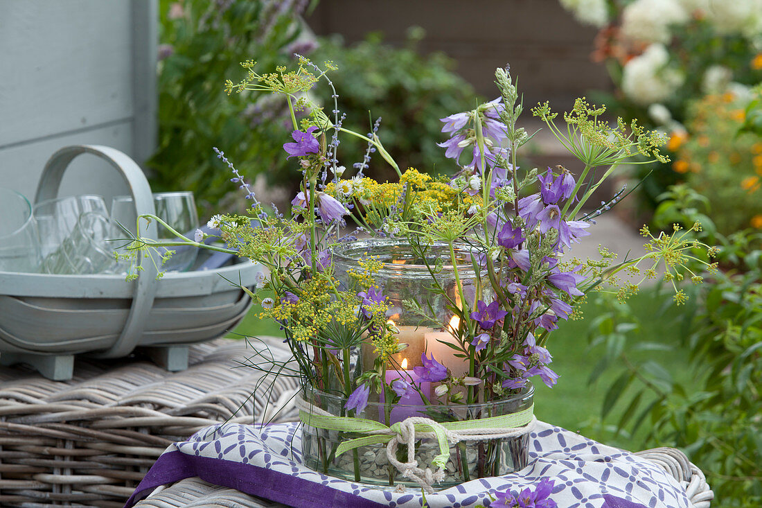 Lantern in glass bowl with bluebells, fennel and honorary prize