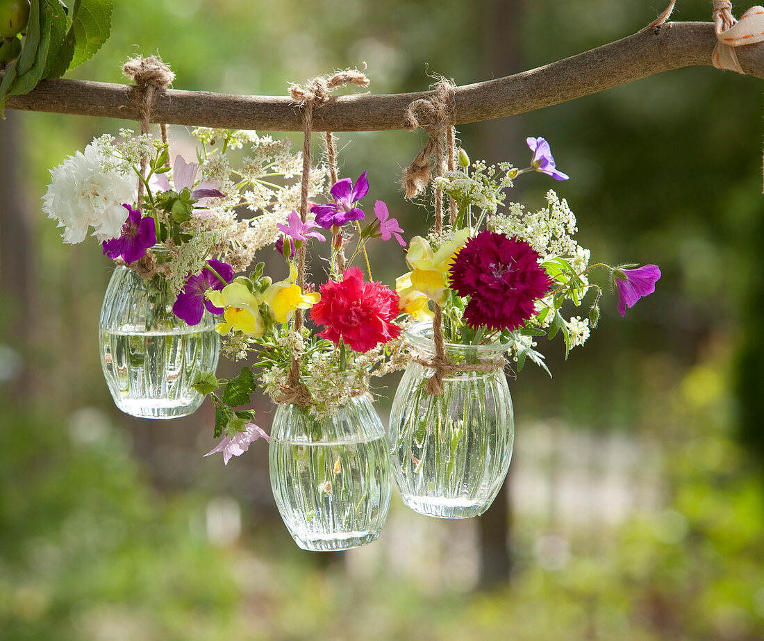 Mini bouquets in hanging jars