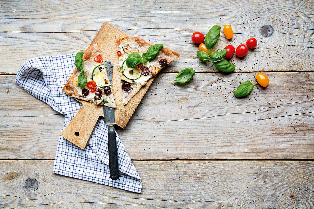 Mediterranean pizza with basil and cherry tomatoes