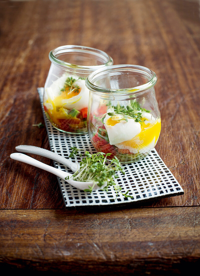 Eggs in glasses with avocado salsa
