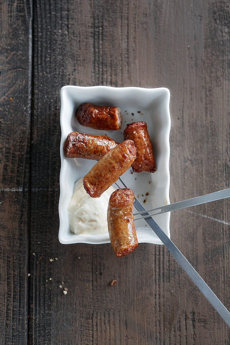 Wurst auf Fonduegabeln