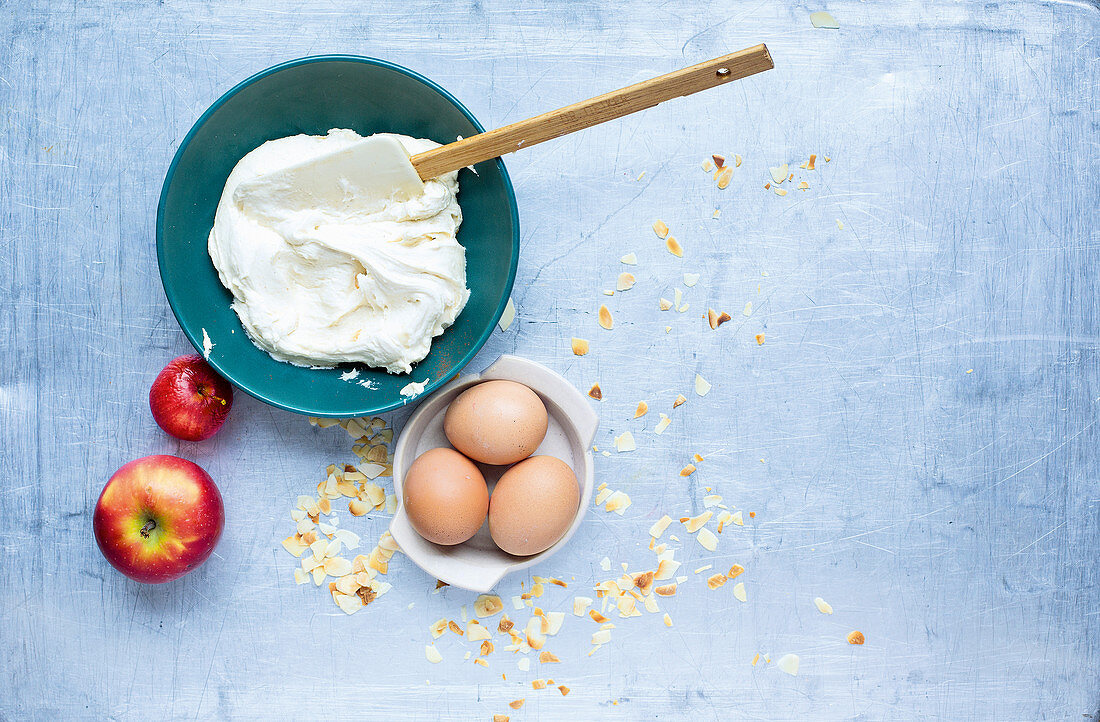 Apples, eggs, whipped cream and flaked almonds