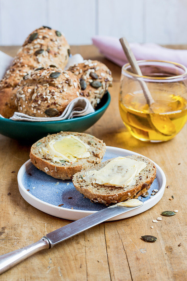 Multi-grain rolls with butter and honey