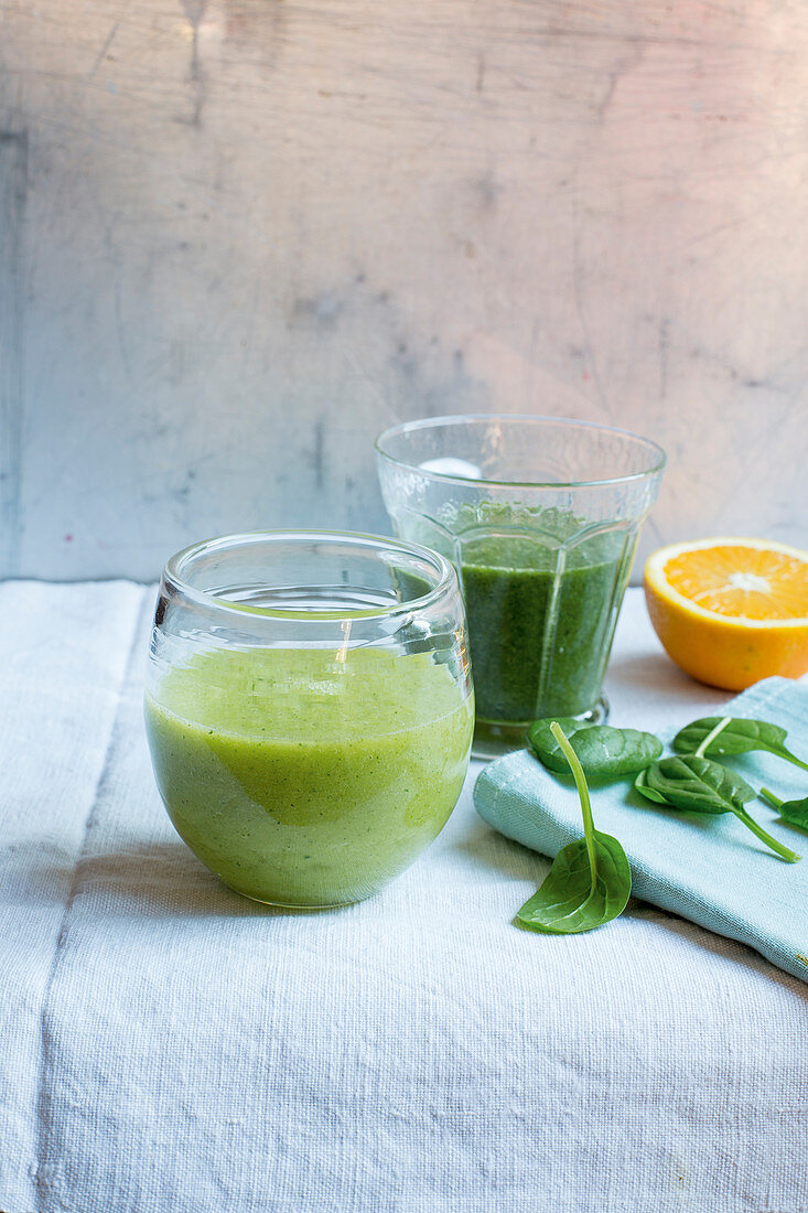 Green smoothies with avocado and with mango and carrot leaves