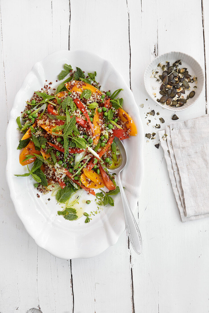 Quinoa salad with vegetables, pumpkin seeds and mint