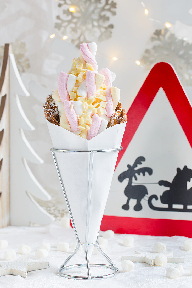 A bubble waffle with frozen yoghurt, white chocolate and marshmallows for Christmas