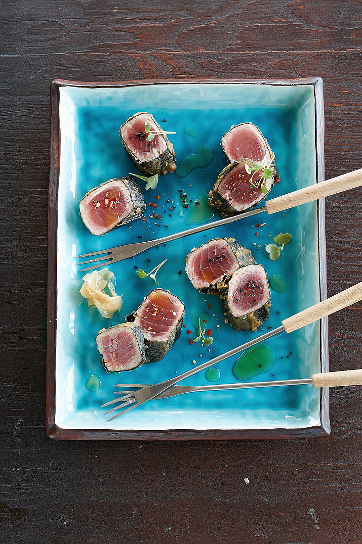 Tuna fish sashimi with fondue forks