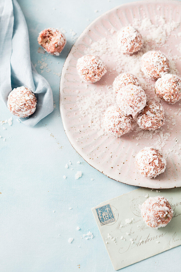Coconut and oat balls with raspberries