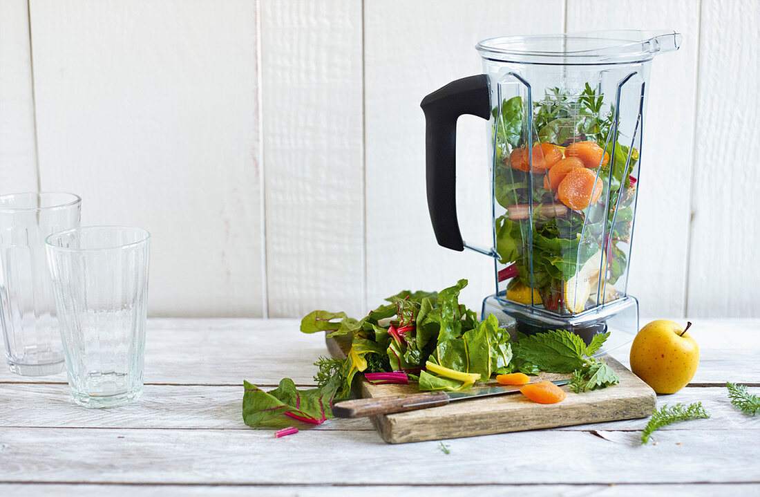 Ingredients for chard and apricot herb shake in a blender