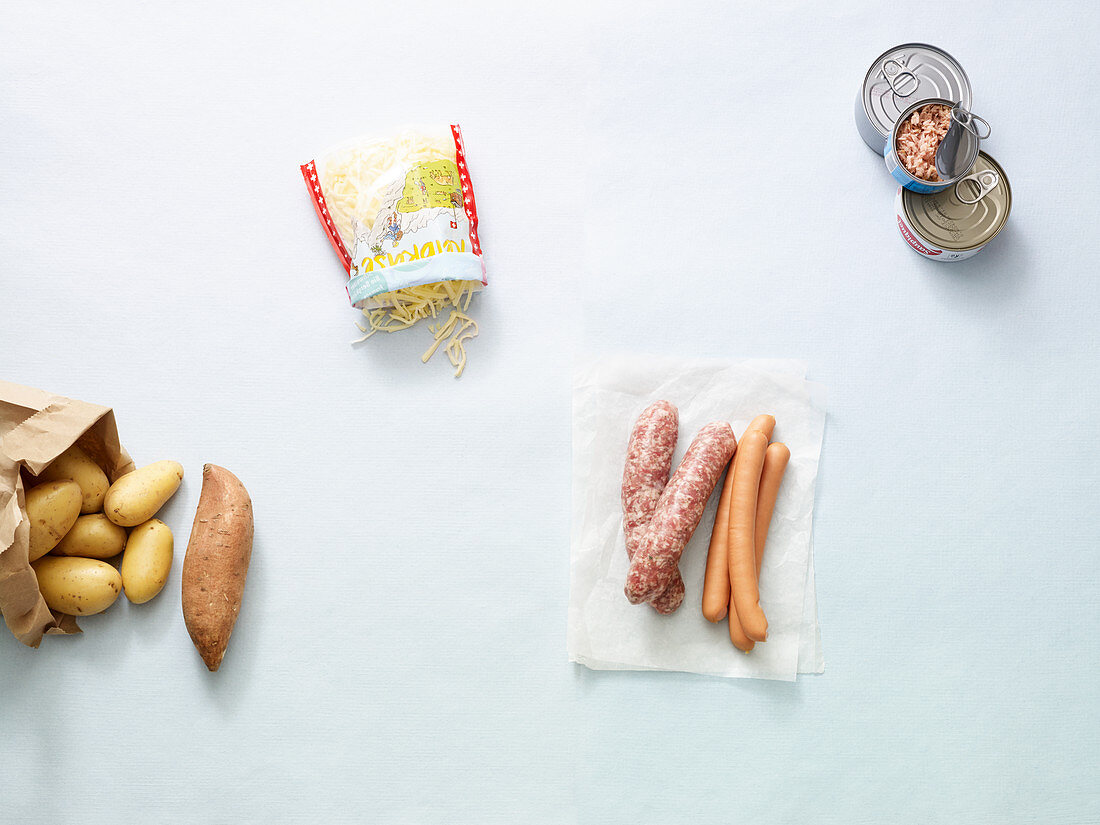 Grated cheese, sweet potatoes, tinned fish and sausages