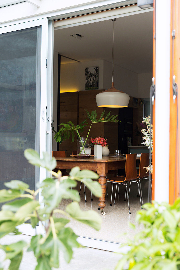 View from the terrace through the open door into the dining room