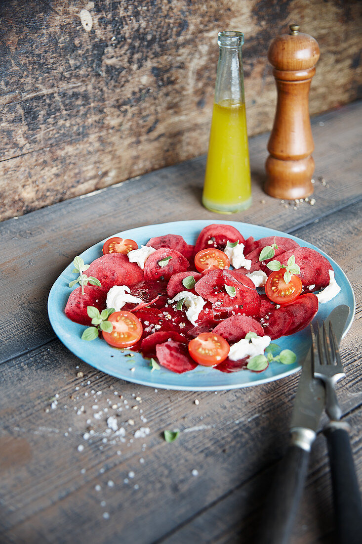 Beetroot carpaccio with tomatoes and morzzarella