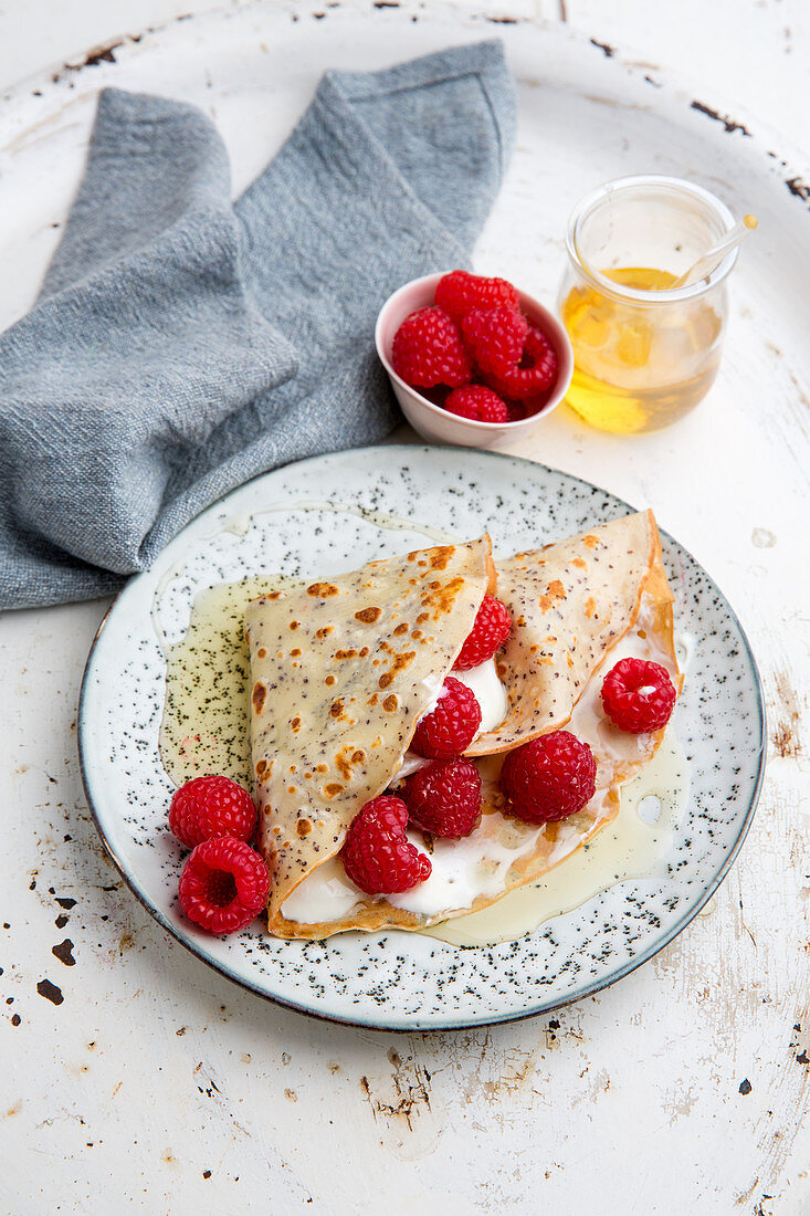 Poppyseed crepes with a raspberry and quark filling