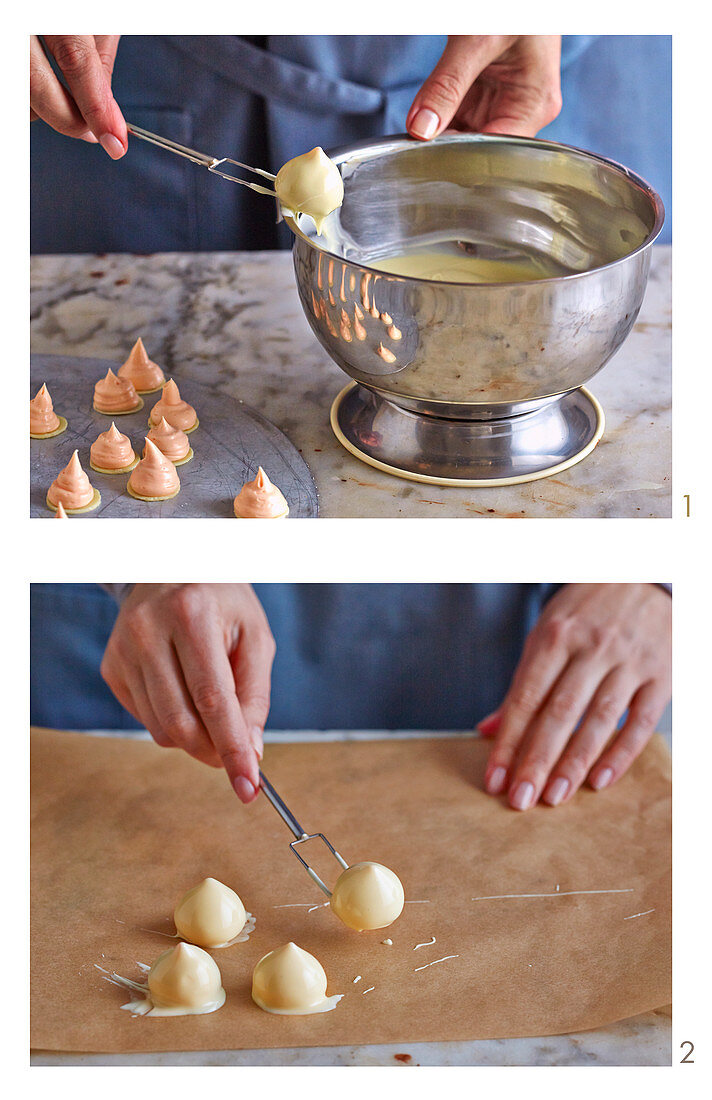 Pralines being covered in white cooking chocolate