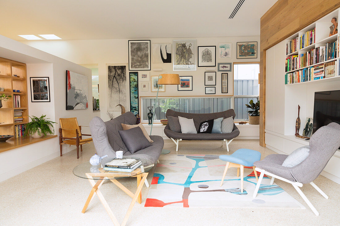 Living room with gray, Scandinavian-style upholstered furniture