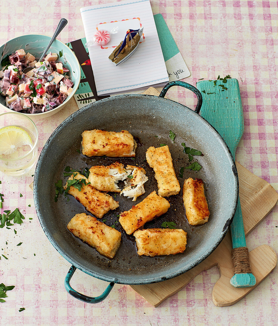 Homemade fish fingers with a beetroot and apple salad