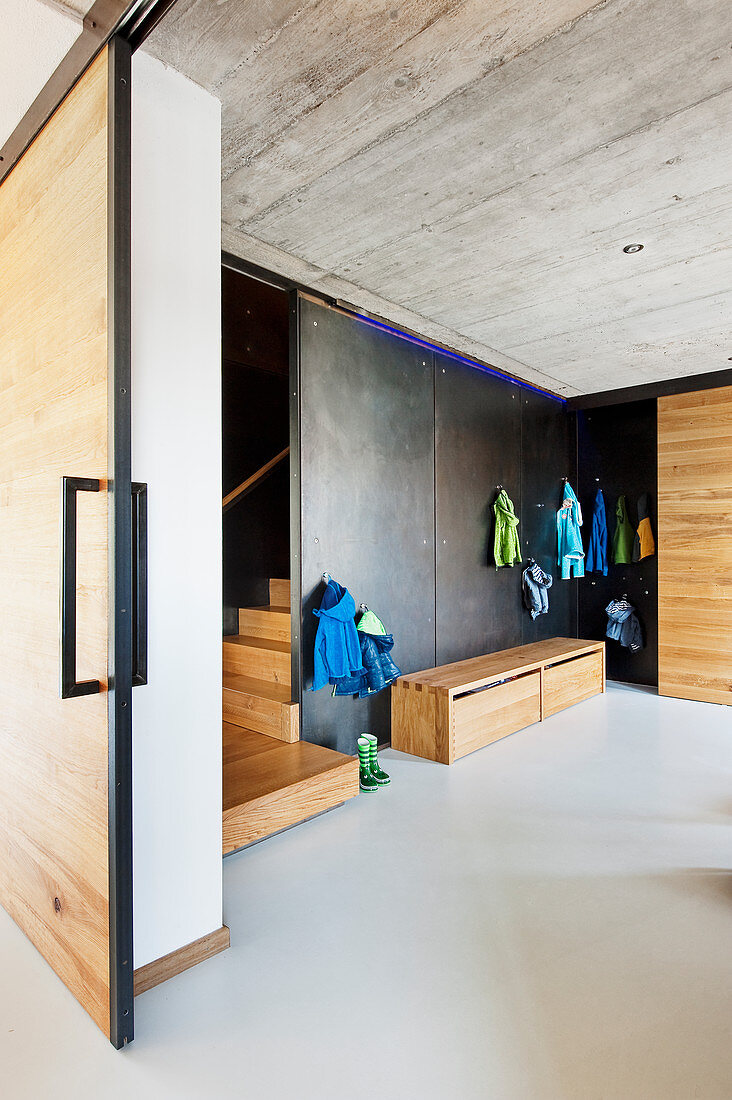 View through open sliding door in industrial-style foyer