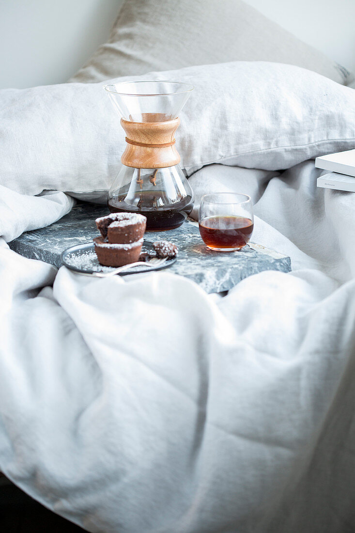 Chocolate and cinnamon muffins served with a glass of coffee