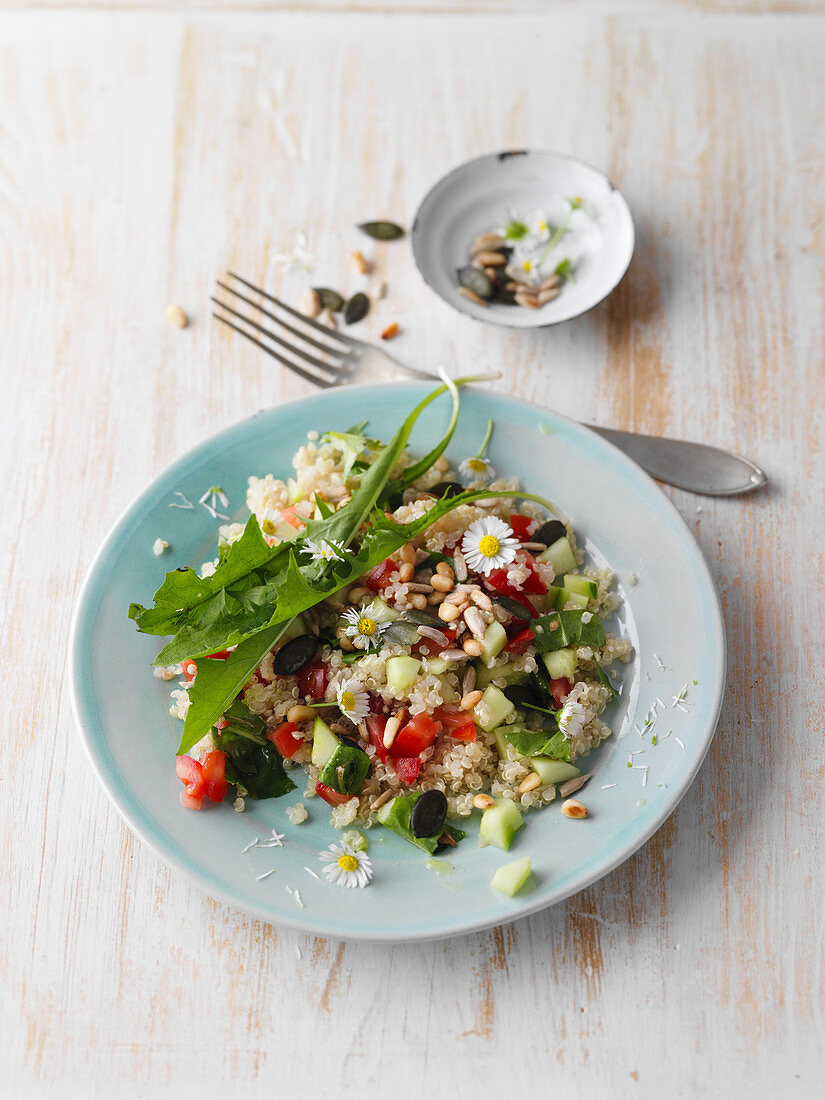 Dandelion and quinoa salad with daisies