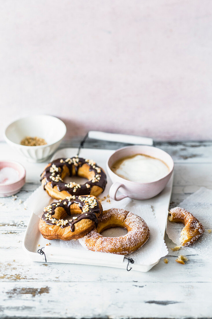 Cronuts with icing sugar and chocolate