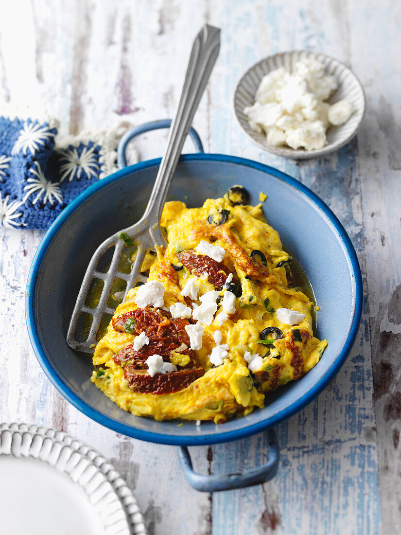 Greek-style scrambled egg with dried tomatoes and feta cheese