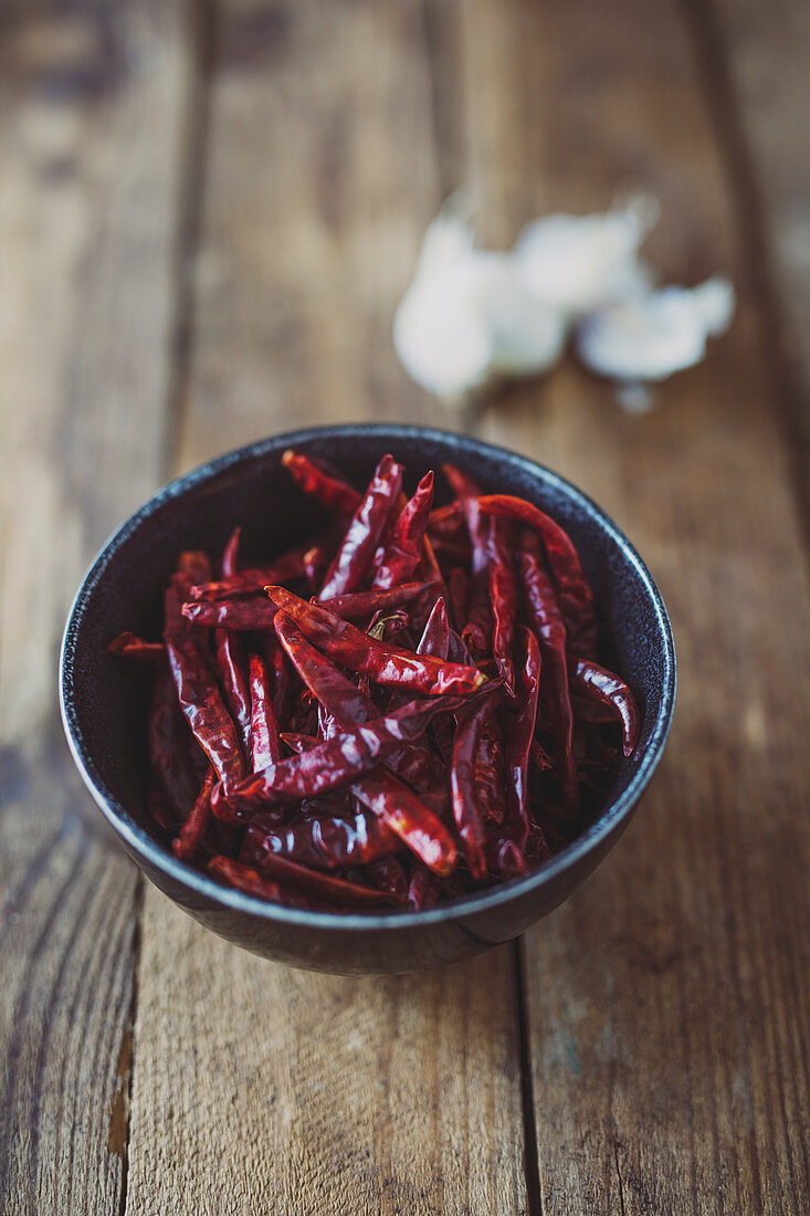 Dried chilli peppers in a small bowl