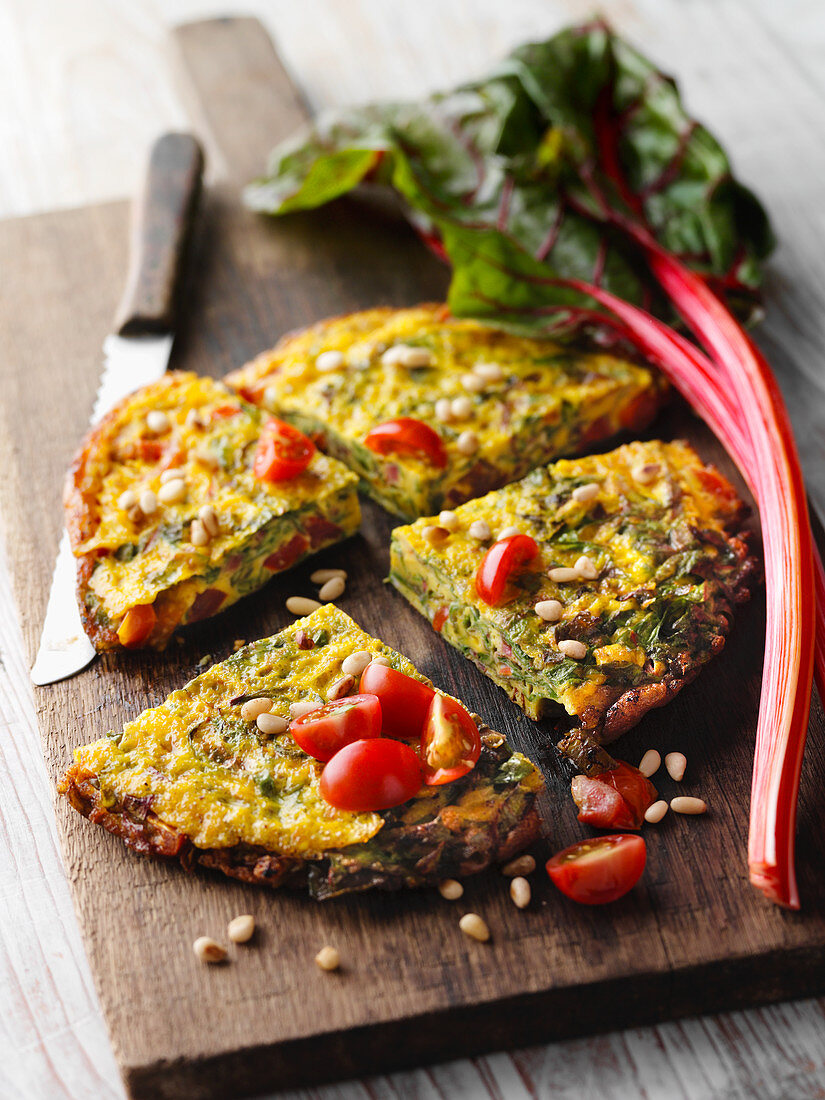 Chard and tomato omelette with pine nuts