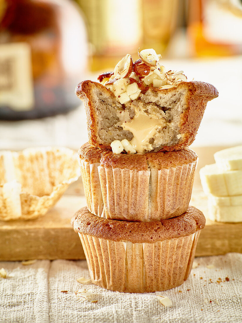 Banana and spelt muffins topped with nuts and honey