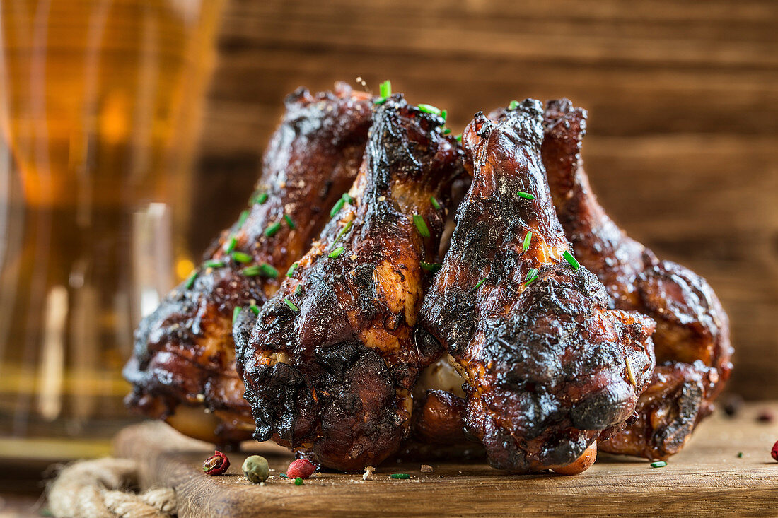 BBQ chicken wings on a wooden board