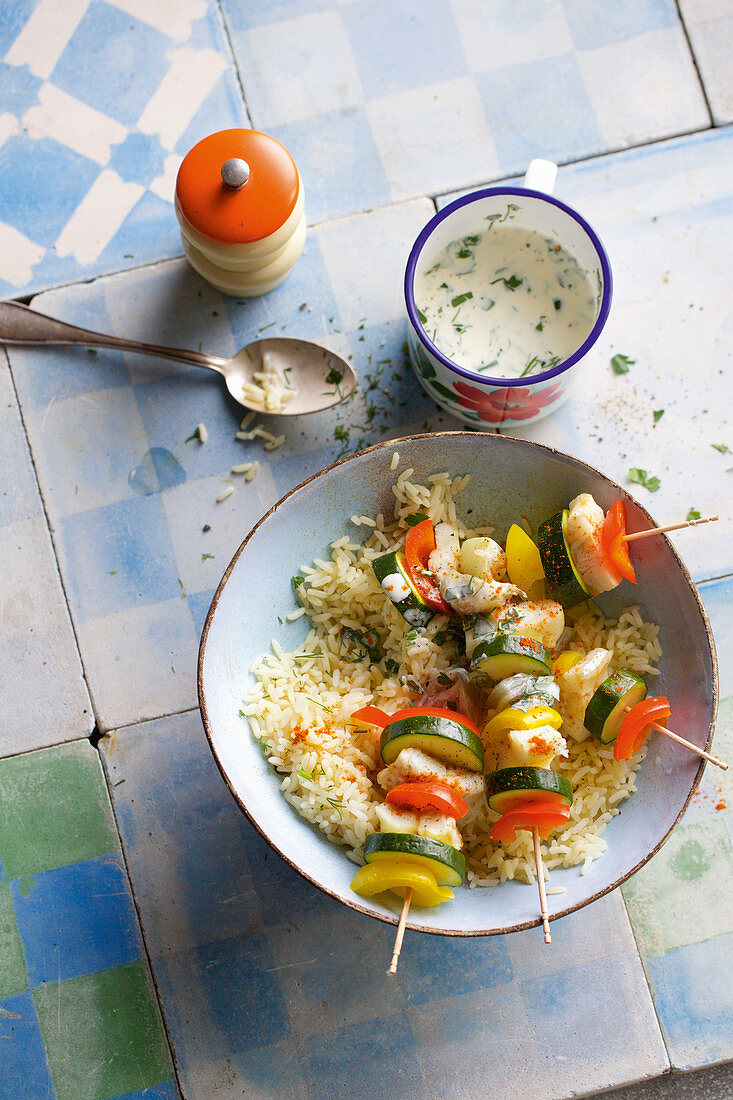 Fish and vegetable skewers with rice