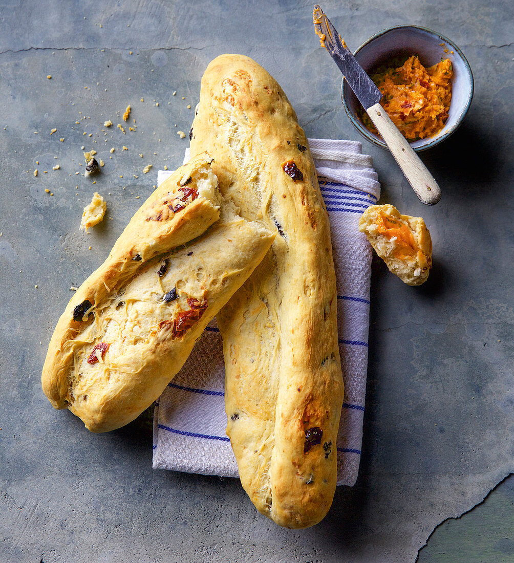 Mediterranean olive baguette with tomato butter