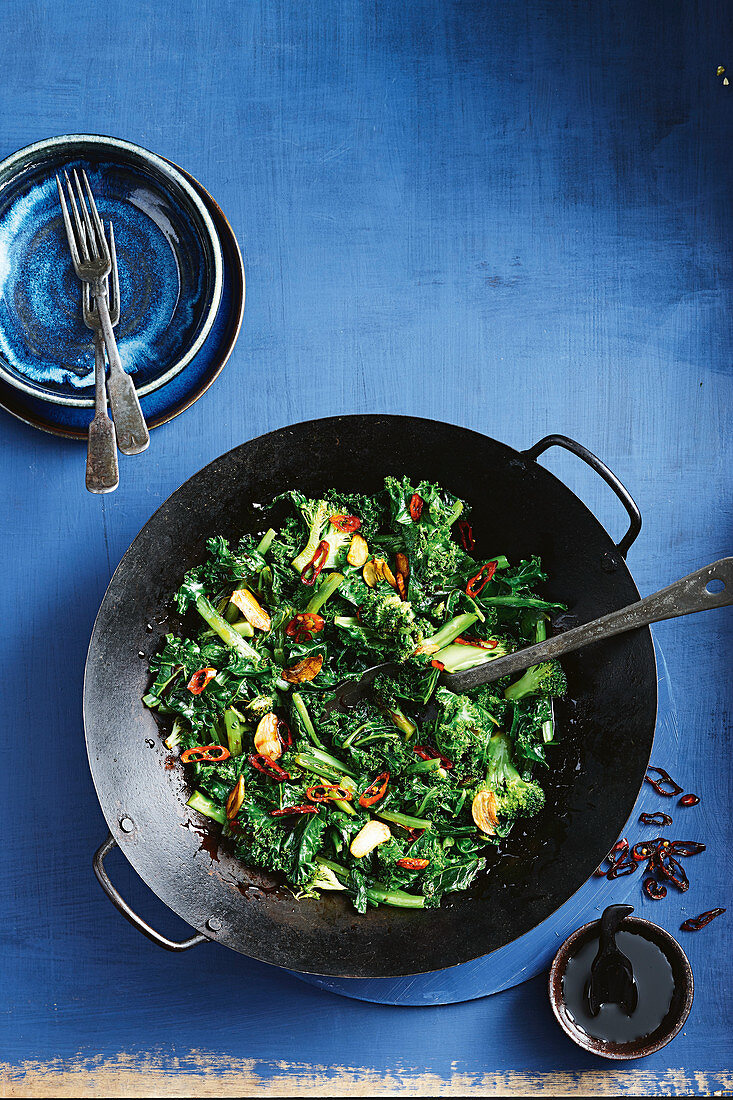 Wok-tossed greens with crispy garlic and chilli