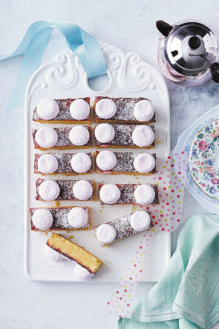 Biscuit bars with raspberry jam, grated coconut and marshmallows