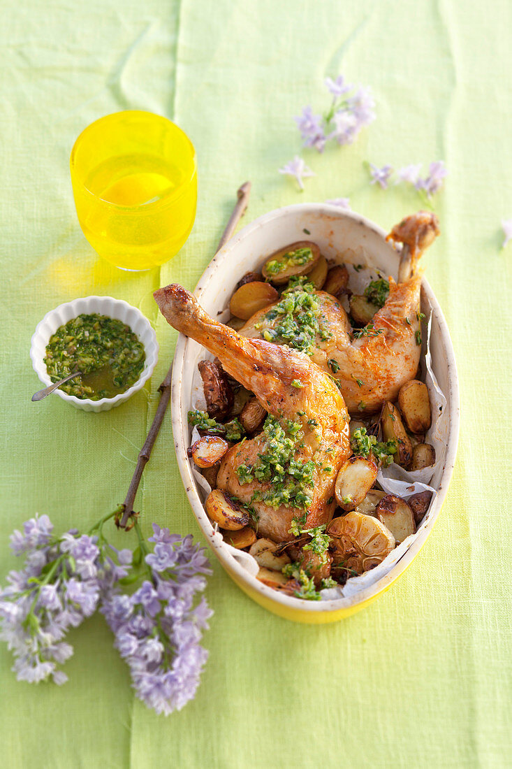 Chicken legs with potatoes, garlic and salsa verde