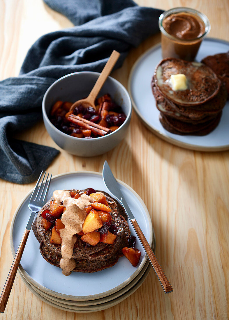 Rye and buckwheat pancakes with apple and cranberry compote, and date and almond butter