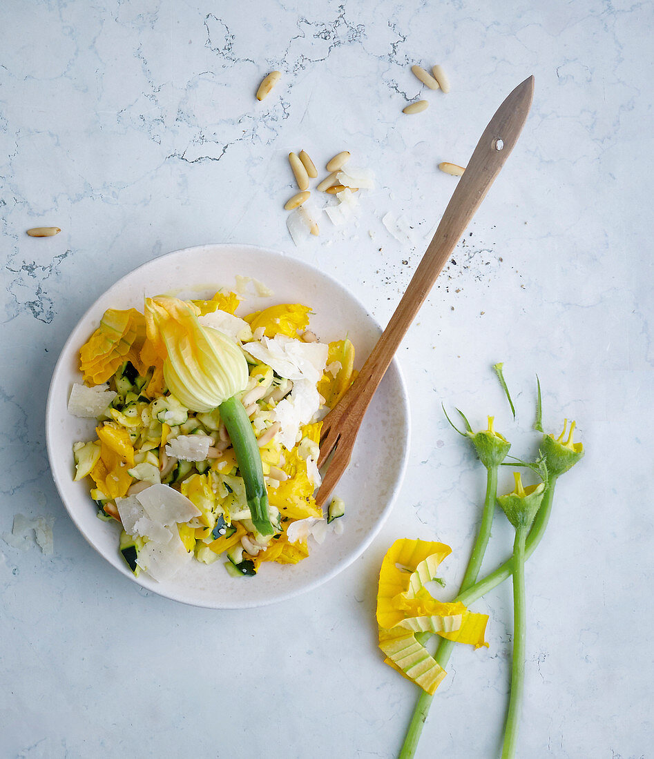 Raw courgette salad with Parmesan cheese and pine nuts