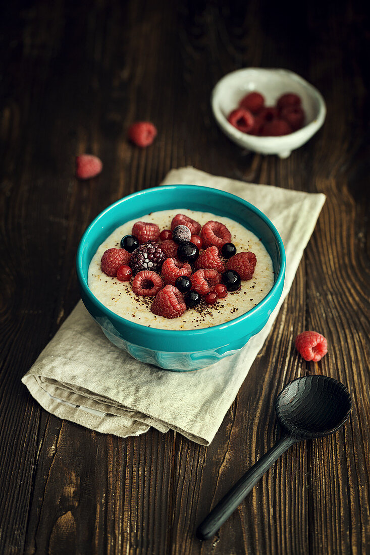 Oatmeal porridge with almond milk and berries