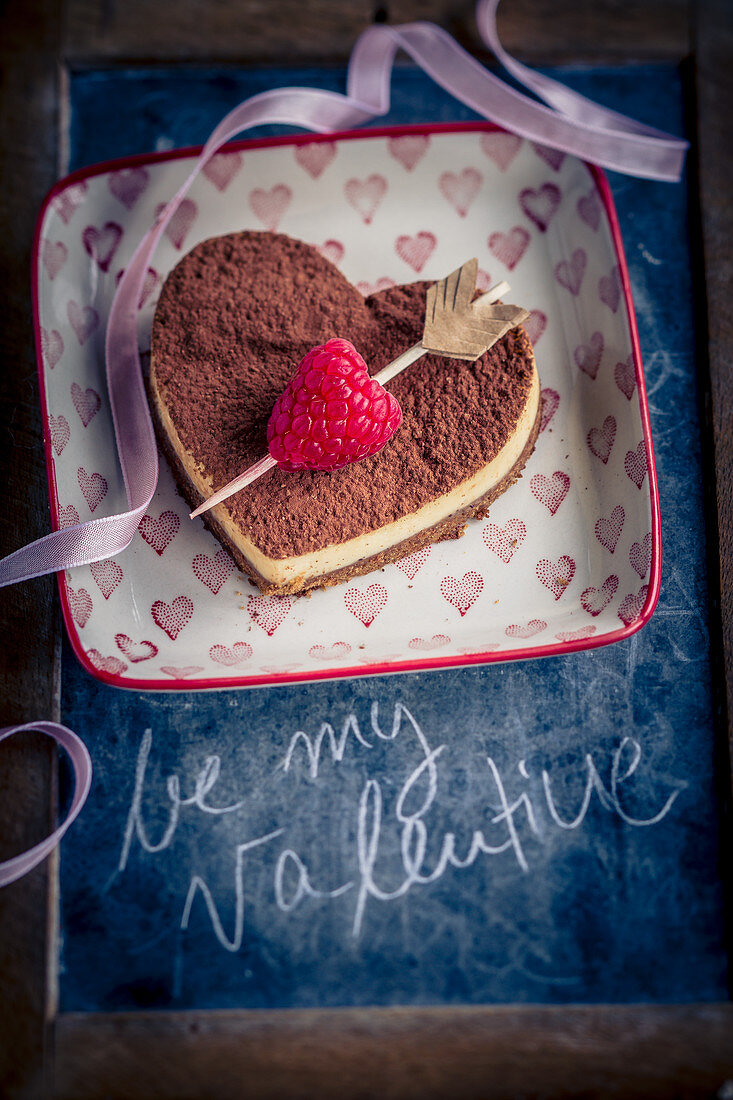 Heart shaped tiramisu with Cupid's arrow and lettering for Valentine's Day
