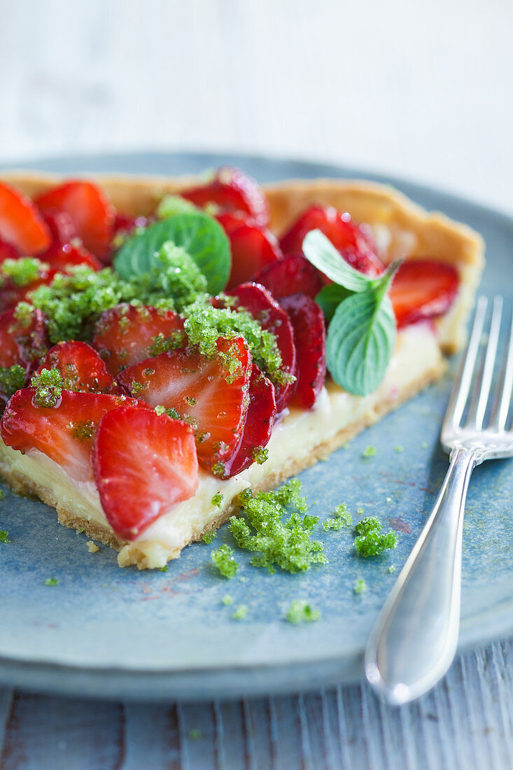 A slice of strawberry tart with herb sugar