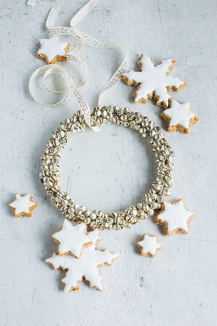 A Christmas wreath and star cookies with white icing
