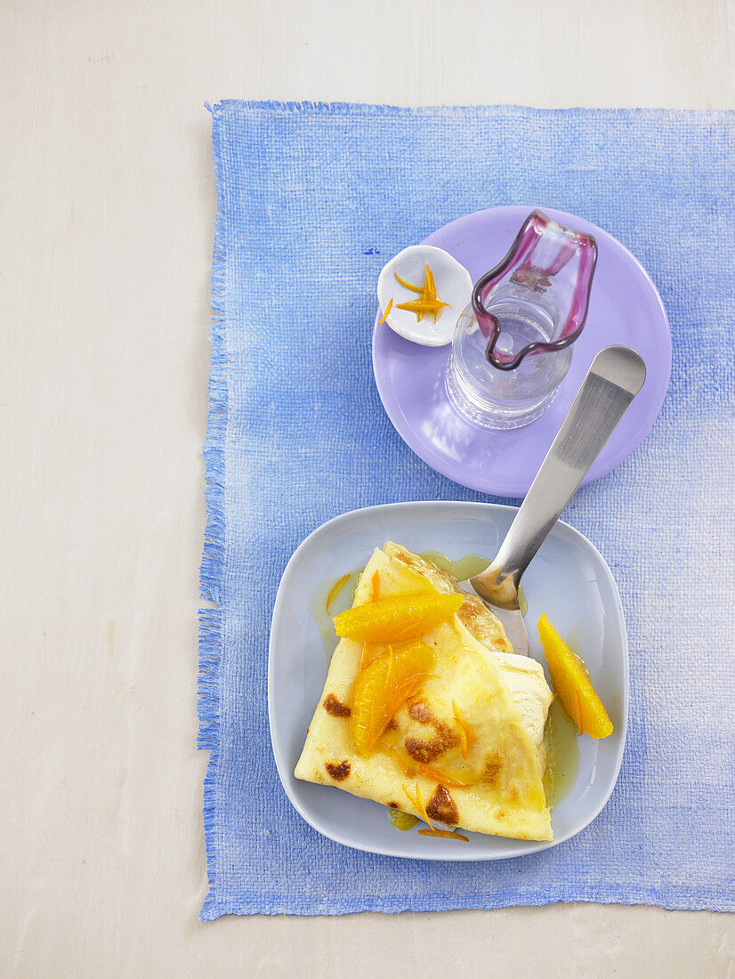 Flambéed crepes with orange and vanilla ice cream