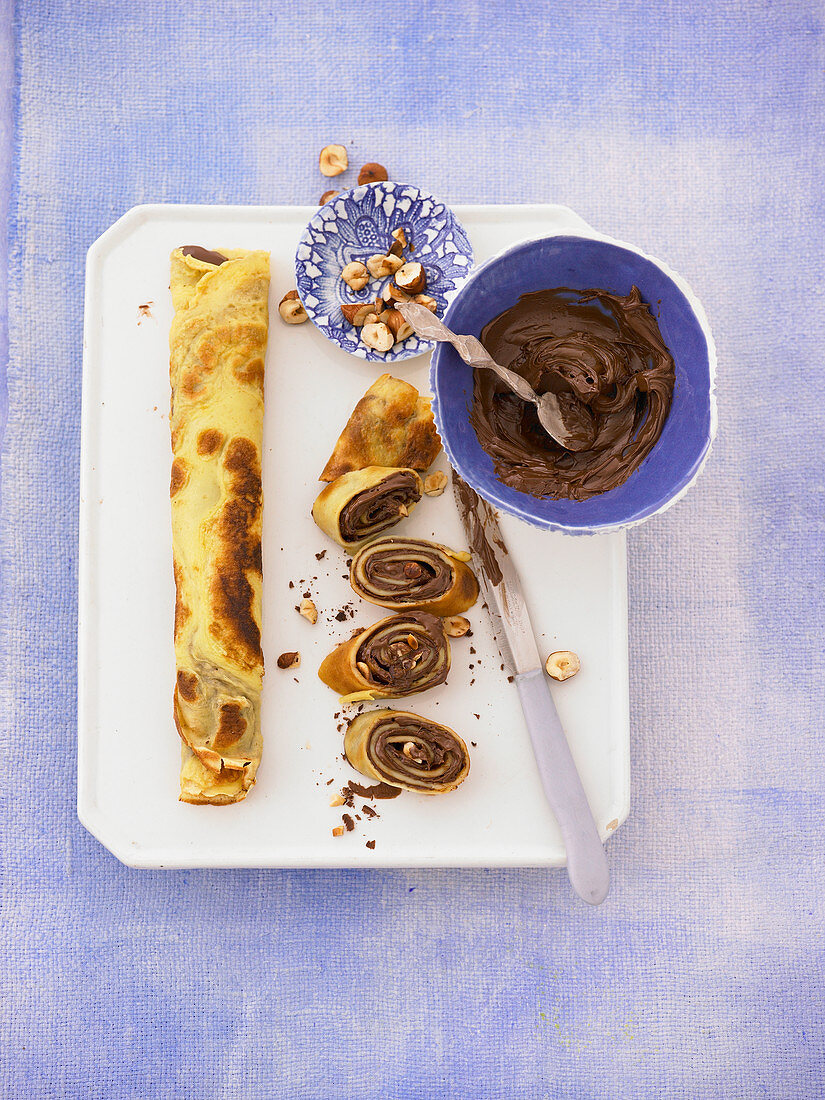 Pancake rolls filled with chocolate and nut spread