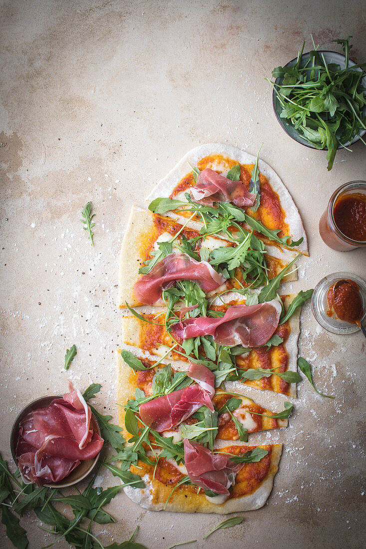 Home made pizza with prosciutto and ruccola