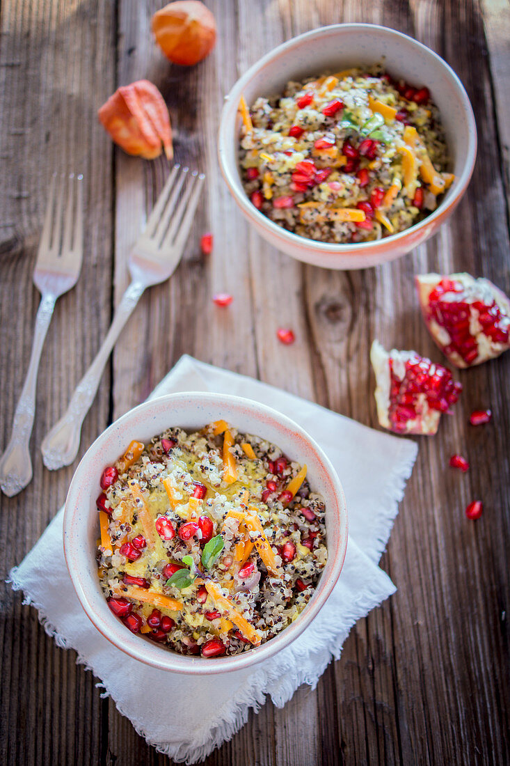 Quinoa bowl with a lemon and mustard dressing and pomegranate seeds