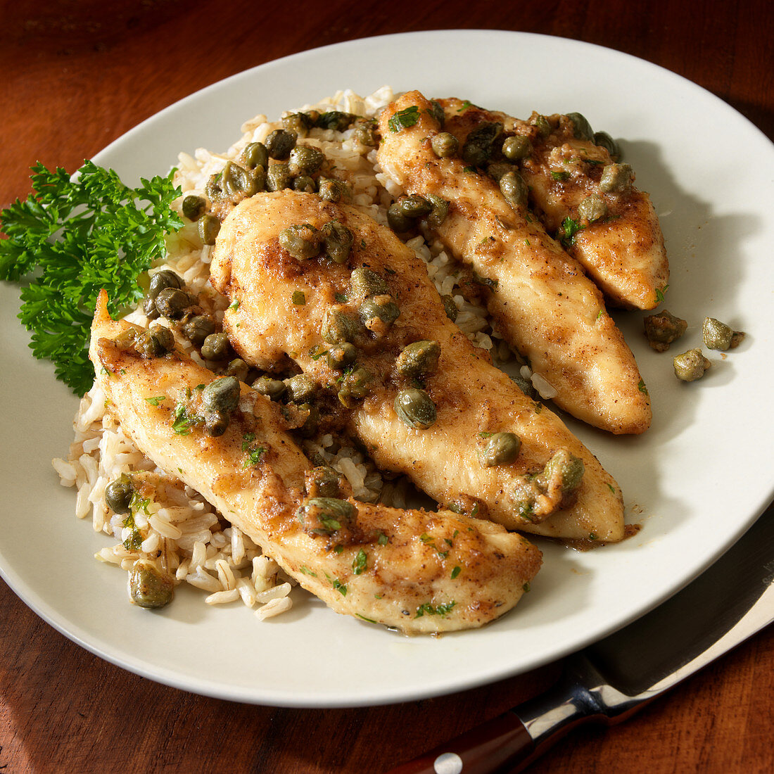 Chicken Picant on brown rice with white wine and capers