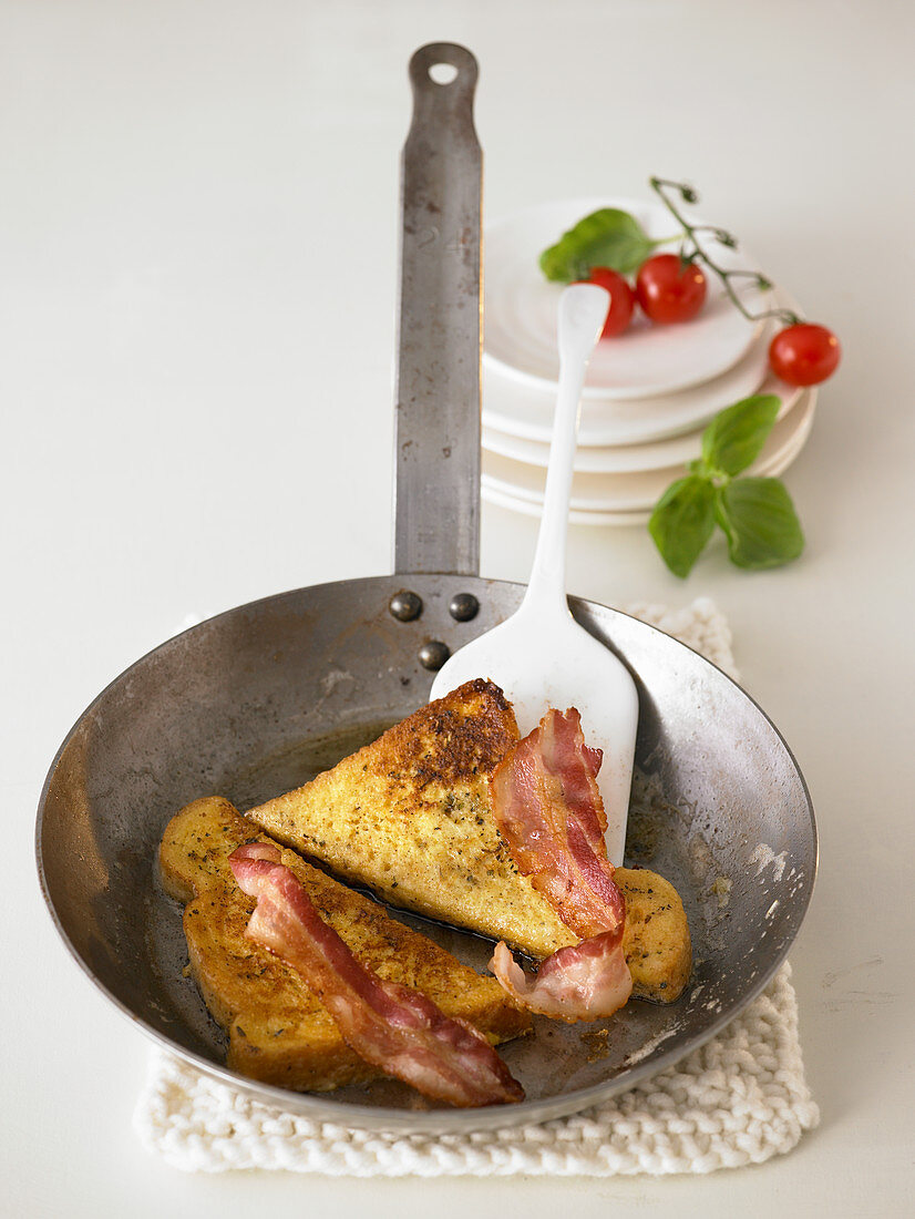 French toast with bacon in a pan