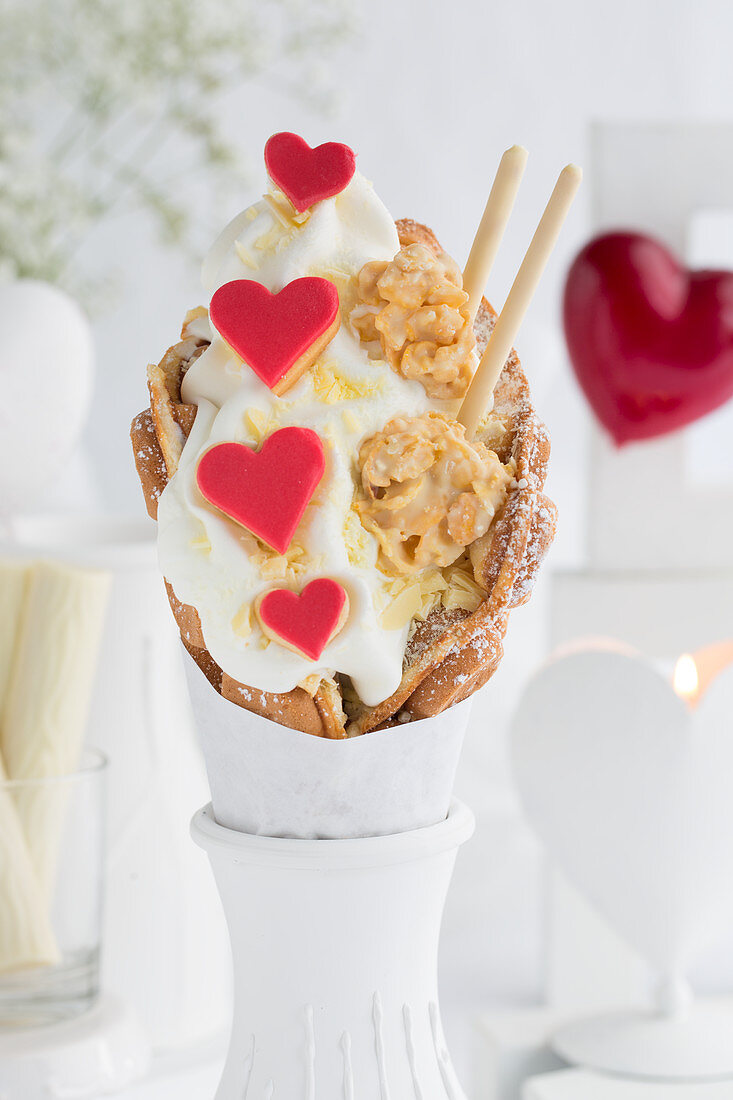 A bubble waffle with frozen yoghurt, heart-shaped biscuits, crispy chocolates and chocolate