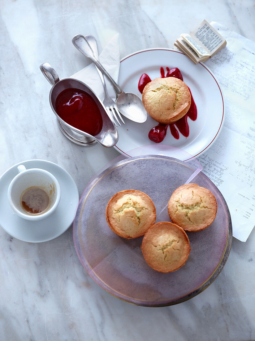 Financiers (French almond cakes) served with fruit purée sauce