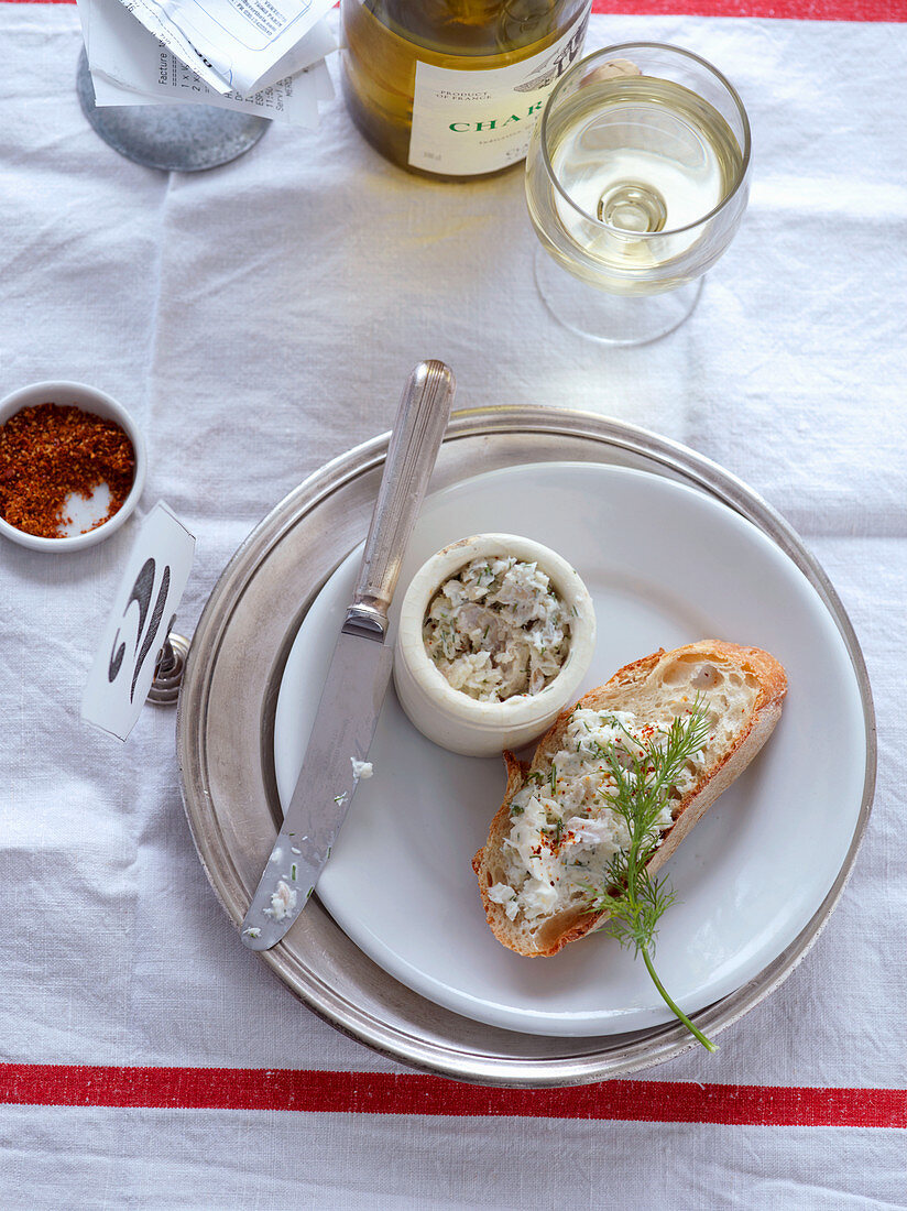 Cod rilettes served with bread and wine